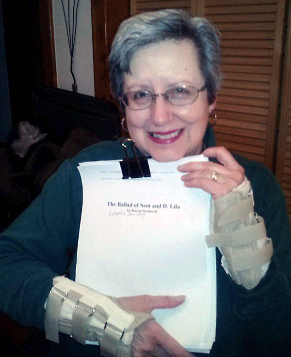 Karen holding new manuscript